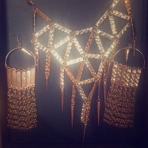 Beautiful gold necklace with matching earrings.